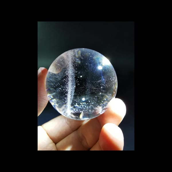 Starry clear quartz sphere, 43.5 mm — detail view