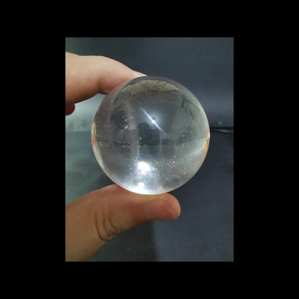 Starry clear quartz sphere, 43.5 mm — detail view