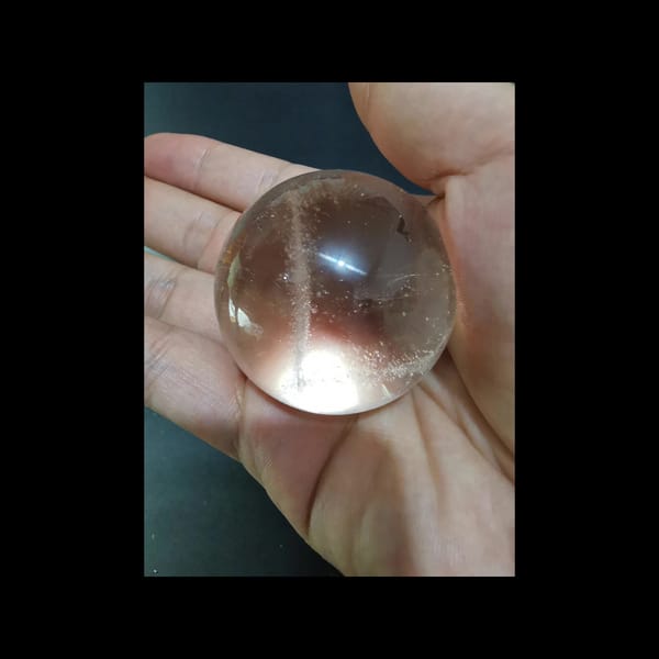Starry clear quartz sphere, 43.5 mm — detail view