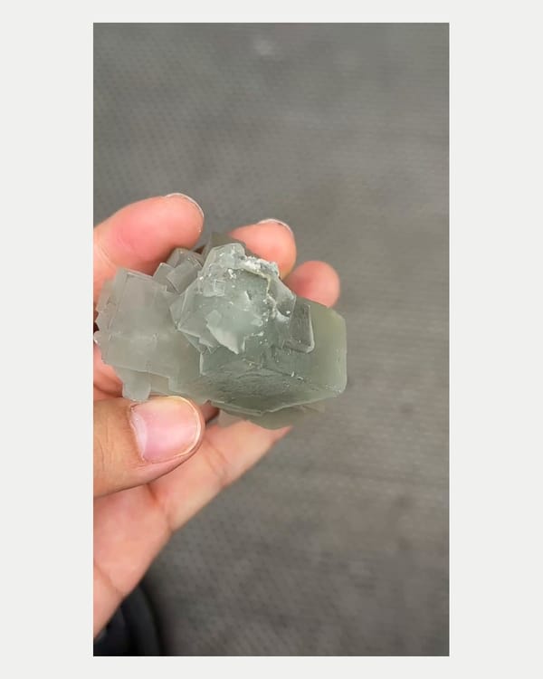 Complete reverse view of stacked green fluorite cluster