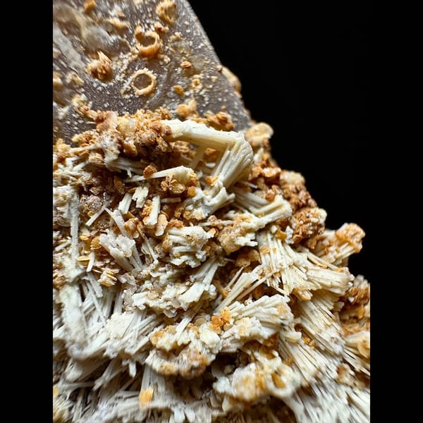 Tall quartz crusted with yellow needle calcite from Inner Mongolia — detail view