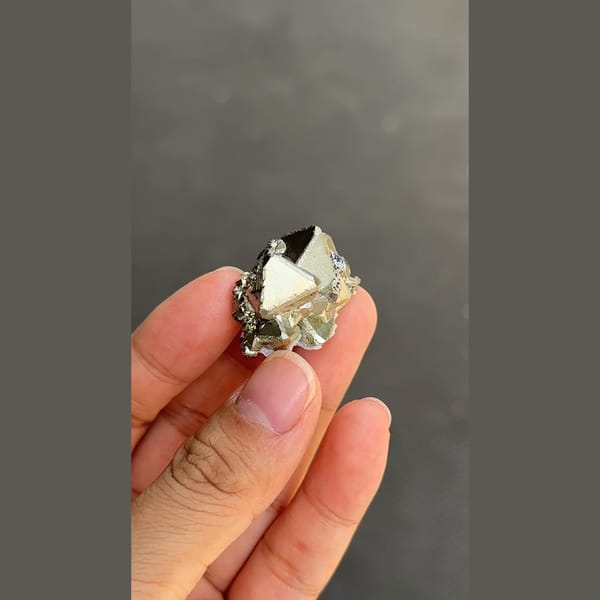 Bright brassy pyrite cluster from Peru — complete view
