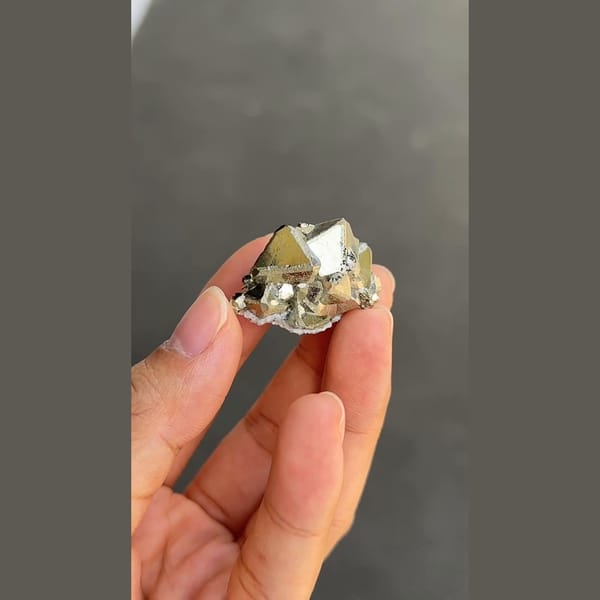 Bright brassy pyrite cluster from Peru — detail view