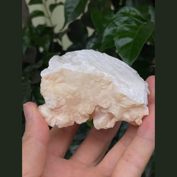 Frosty peach to pale pink calcite crystal cluster — detail view