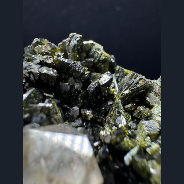 Ball-shaped quartz cluster with green epidote from Turkey — detail view
