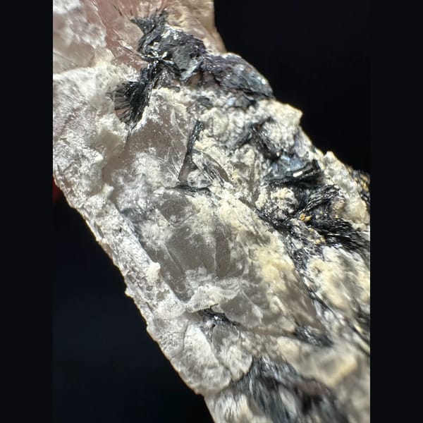 Pale amethyst with an open specular hematite rosette from Inner Mongolia — detail view