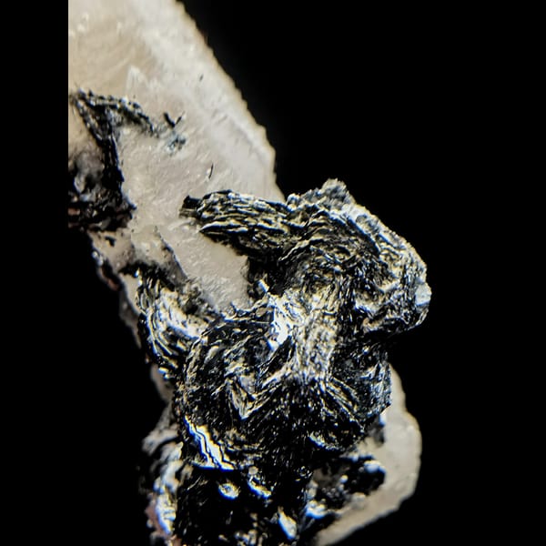 Quartz with specular hematite rosettes from Inner Mongolia — detail view
