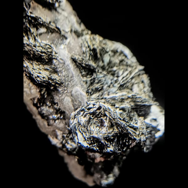 Quartz with specular hematite rosettes from Inner Mongolia — detail view