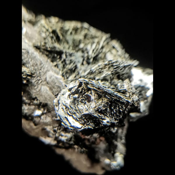 Quartz with specular hematite rosettes from Inner Mongolia — detail view