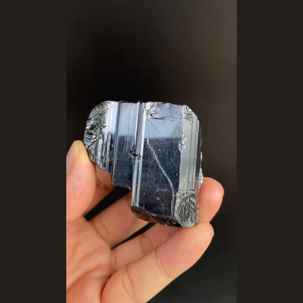Large lustrous steel-grey bournonite cogwheel crystals from Yaogangxian — detail view