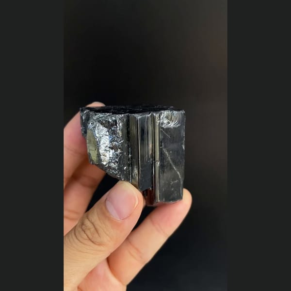Large lustrous steel-grey bournonite cogwheel crystals from Yaogangxian — detail view