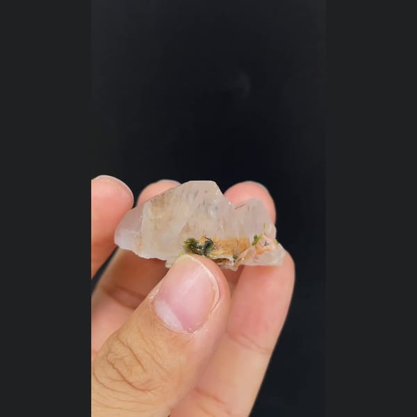 Clear garden quartz with orange inclusions from Meigu, Sichuan — alternate view