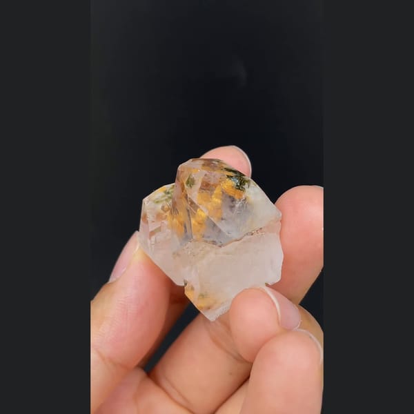 Clear garden quartz with orange inclusions from Meigu, Sichuan — alternate view