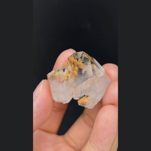 Clear garden quartz with orange inclusions from Meigu, Sichuan — detail view