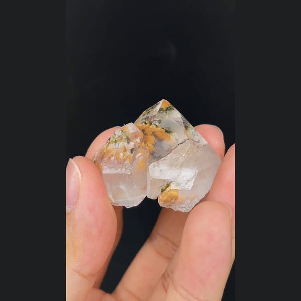 Clear garden quartz with orange inclusions from Meigu, Sichuan — detail view