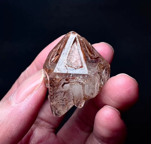 Five-Window Red-Clay Skeletal Quartz Point — Madagascar — individual mineral specimen view 2