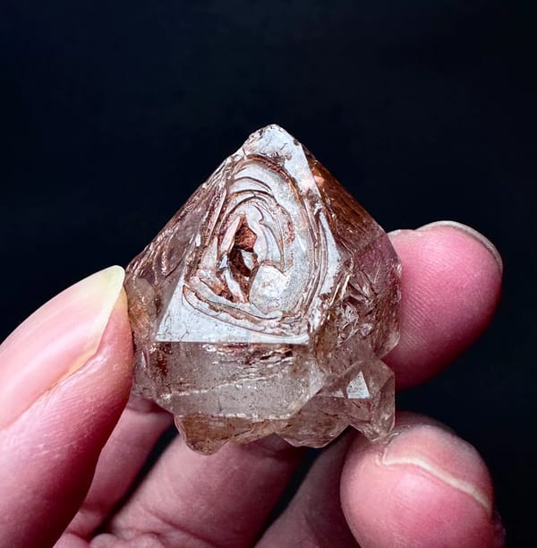 Five-Window Red-Clay Skeletal Quartz Point — Madagascar — individual mineral specimen view 4