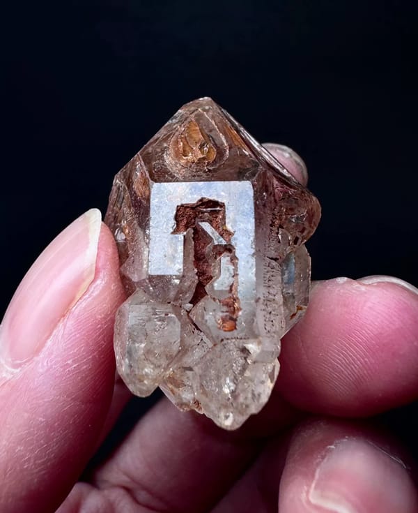 Five-Window Red-Clay Skeletal Quartz Point — Madagascar — individual mineral specimen view 5