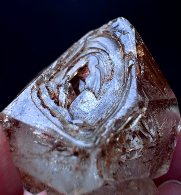 Five-Window Red-Clay Skeletal Quartz Point — Madagascar — individual mineral specimen view 6