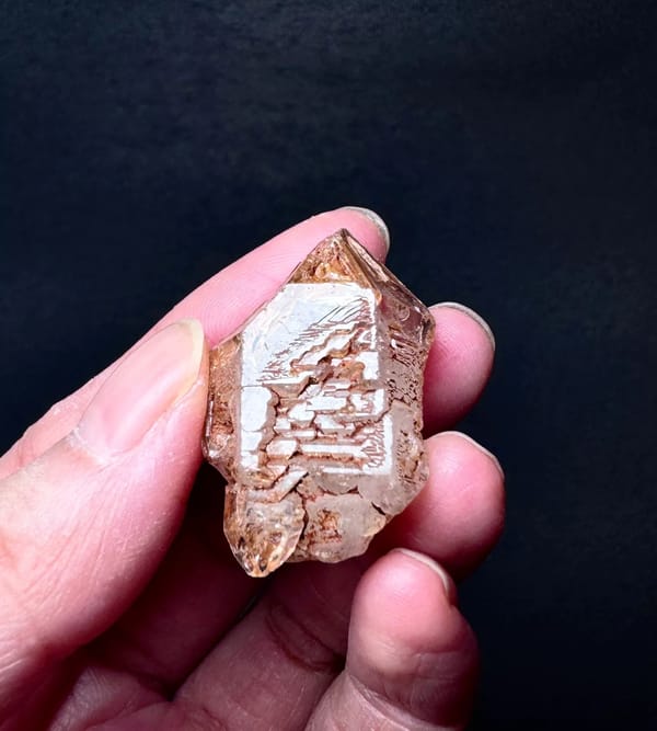 Stepped Red-Clay Skeletal Quartz Crystal — Madagascar — individual mineral specimen view 3