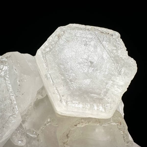 Flat hexagonal coin calcite crystals from Fujian — complete view