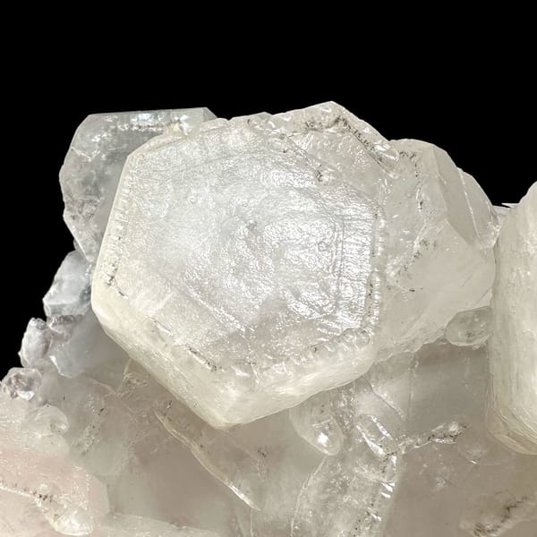 Flat hexagonal coin calcite crystals from Fujian — alternate view