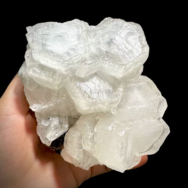 Chunky cluster of milky hexagonal calcite crystals from Fujian — complete view