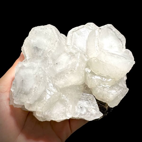 Chunky cluster of milky hexagonal calcite crystals from Fujian — alternate view
