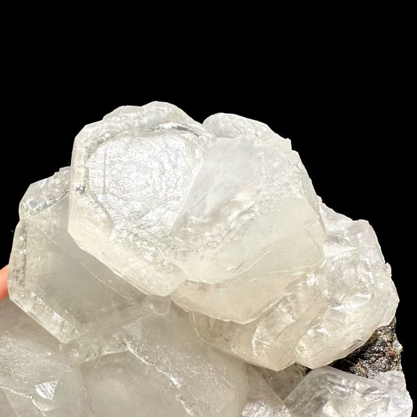 Chunky cluster of milky hexagonal calcite crystals from Fujian — detail view