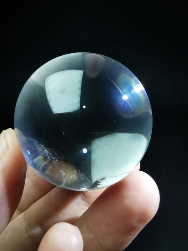 Clear Quartz Sphere with Blade-Like Veil — complete mineral specimen view 1