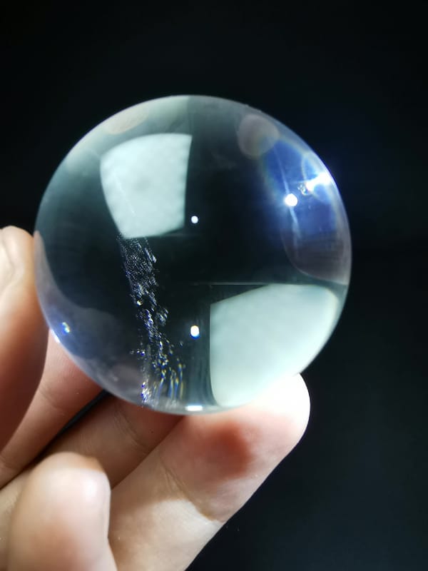 Clear Quartz Sphere with Blade-Like Veil — complete mineral specimen view 3