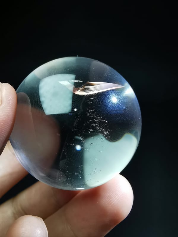 Clear Quartz Sphere with Blade-Like Veil — complete mineral specimen view 4