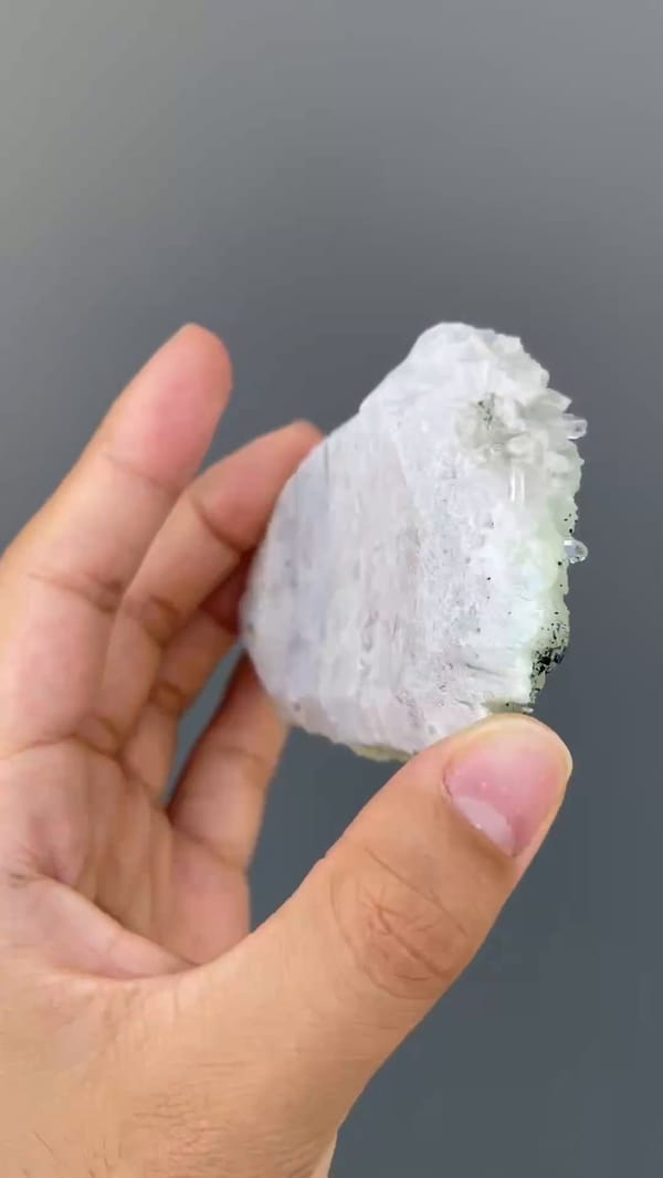 Complete side view showing the thin crystal-covered Qiaojia prehnite and quartz specimen