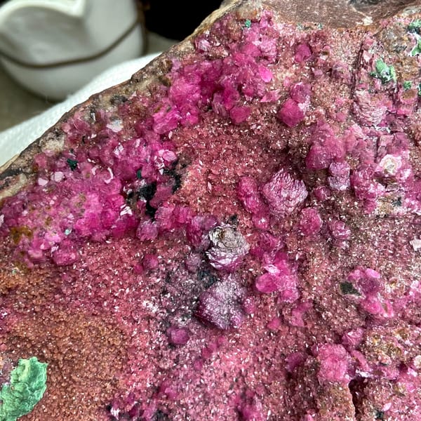 Large magenta cobaltoan calcite with malachite — detail view