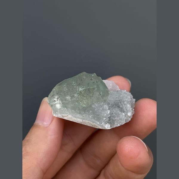 Pale mint green fluorite with quartz from Fujian — detail view