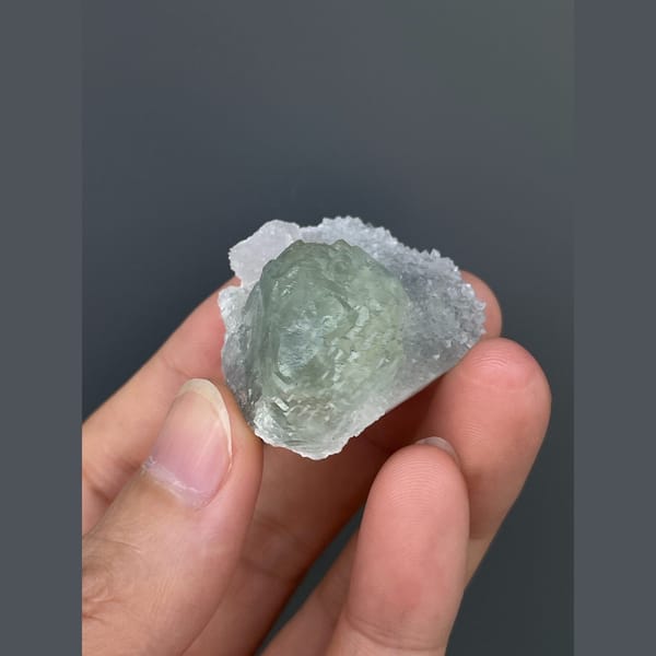 Pale mint green fluorite with quartz from Fujian — detail view