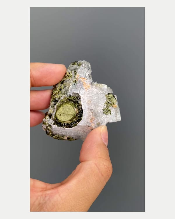 Complete underside view of epidote with quartz crystals
