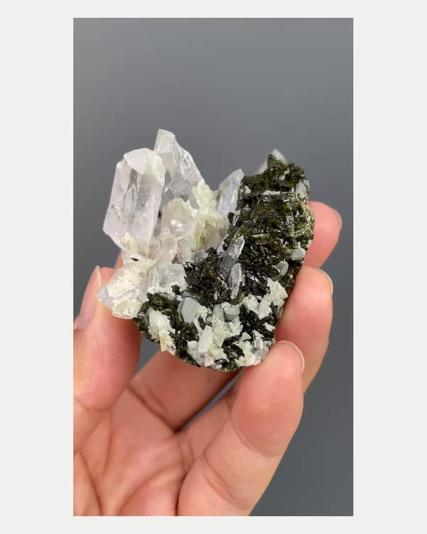 Complete right oblique view of epidote with quartz crystals
