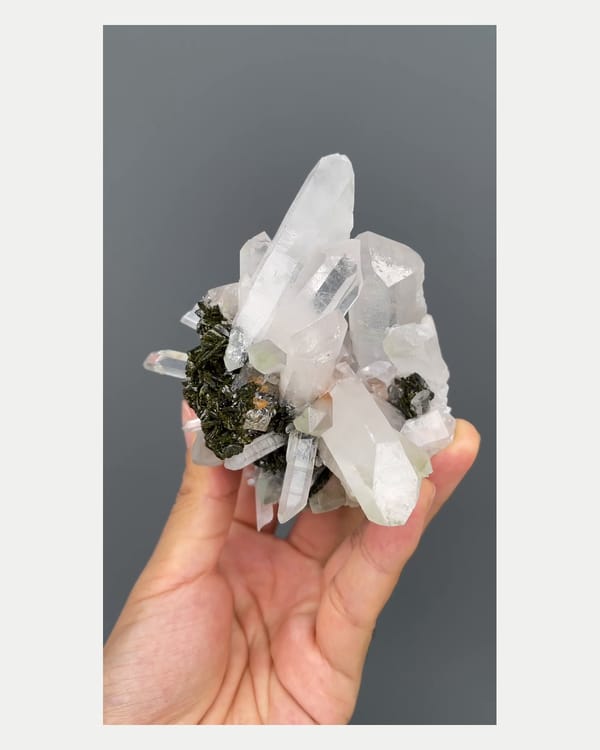 Complete front view of epidote with quartz crystals