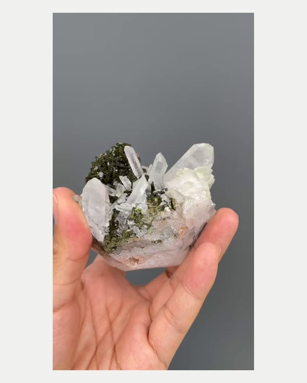 Complete right oblique view of epidote with quartz crystals