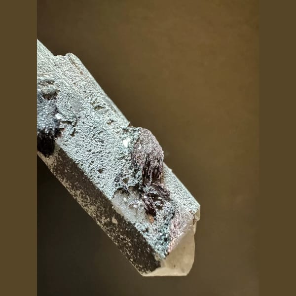 Double-terminated quartz with specular hematite from Inner Mongolia — detail view