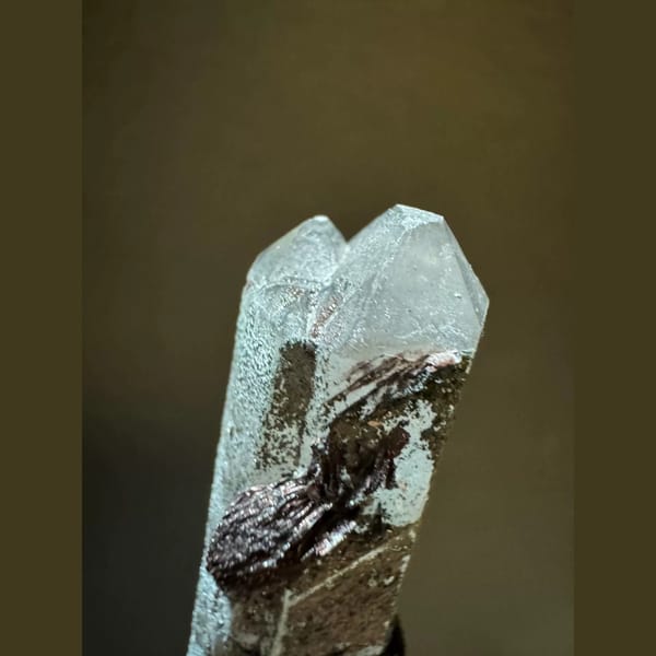 Double-terminated quartz with specular hematite from Inner Mongolia — detail view