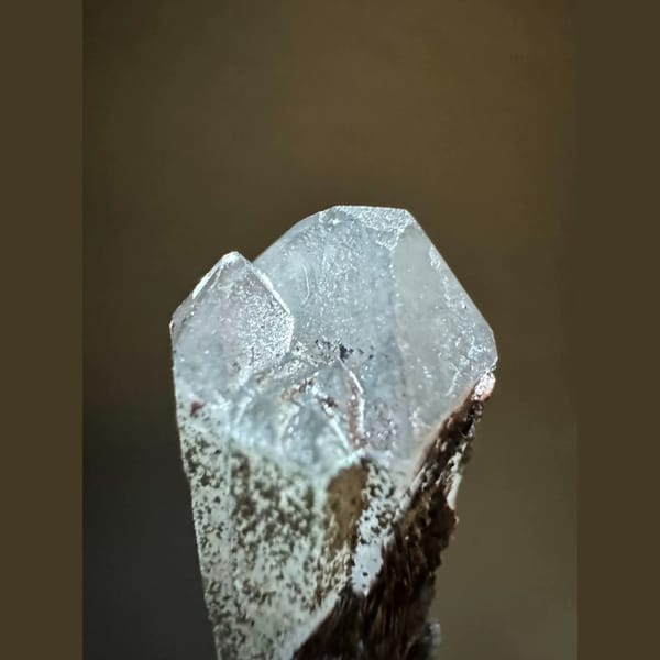 Double-terminated quartz with specular hematite from Inner Mongolia — detail view