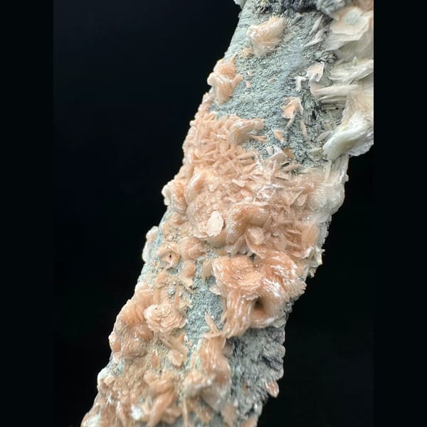 Quartz with pink petal calcite and specular hematite from Inner Mongolia — detail view