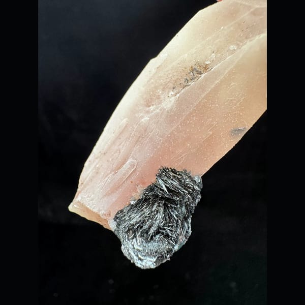 Pink quartz with specular hematite rosette from Inner Mongolia — detail view