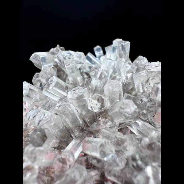 Clear calcite floater cluster from Fujian — detail view