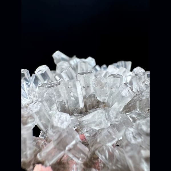 Clear calcite floater cluster from Fujian — detail view