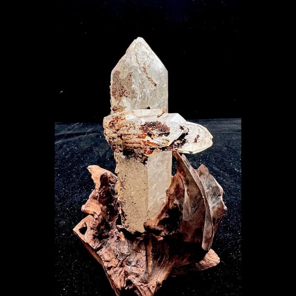 Large Himalayan quartz floater from Tibet on a wood stand — complete view