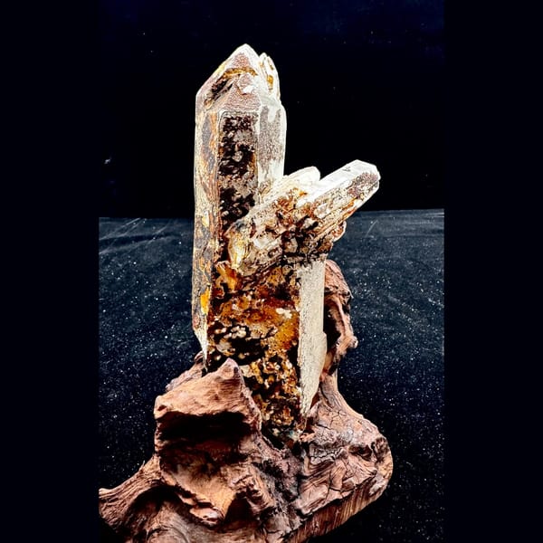 Large Himalayan quartz floater from Tibet on a wood stand — alternate view