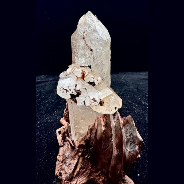 Large Himalayan quartz floater from Tibet on a wood stand — detail view